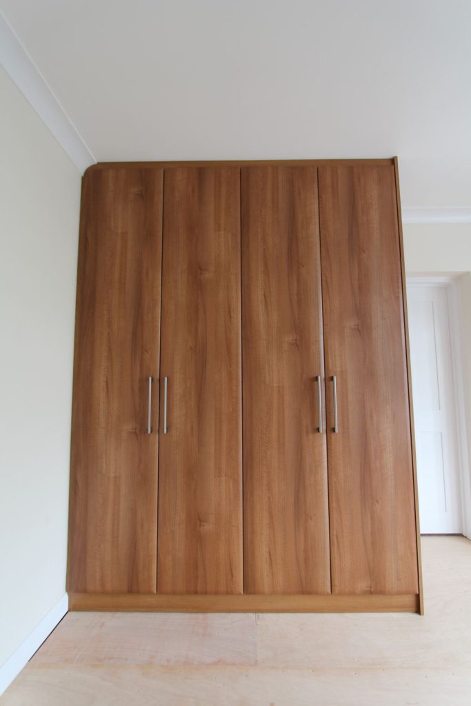 Bespoke fitted walnut wardrobe, Winchmore Hill, N21